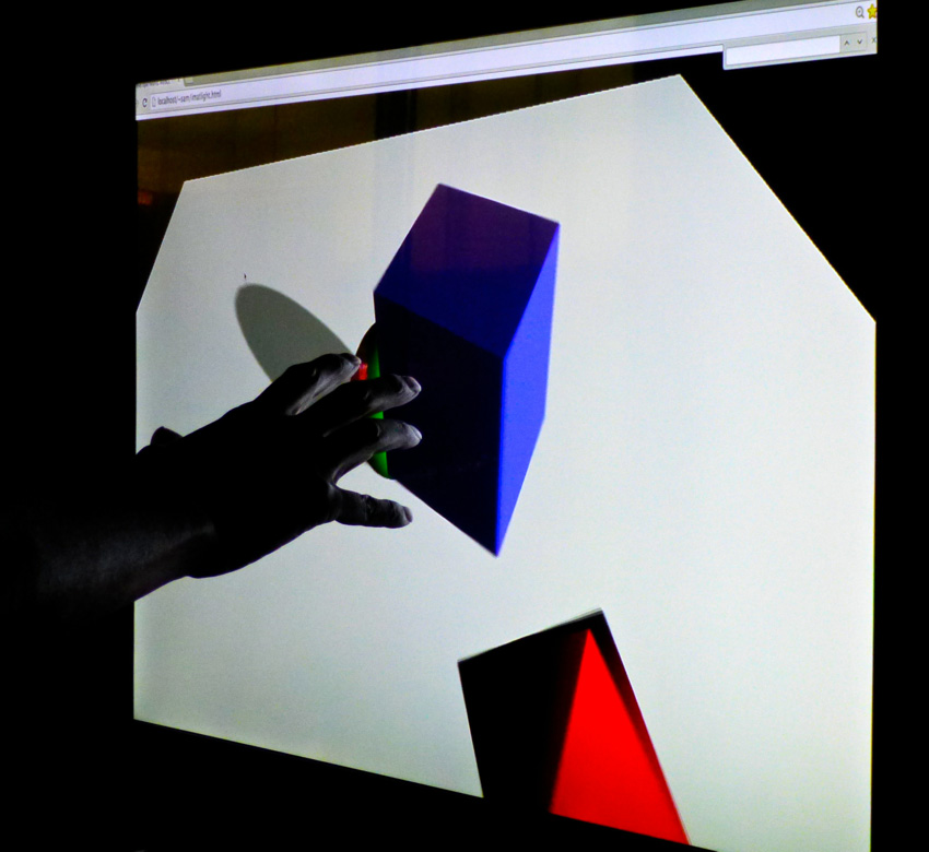 Image shows user interacting in 3D with scene via Leap Motion Controller